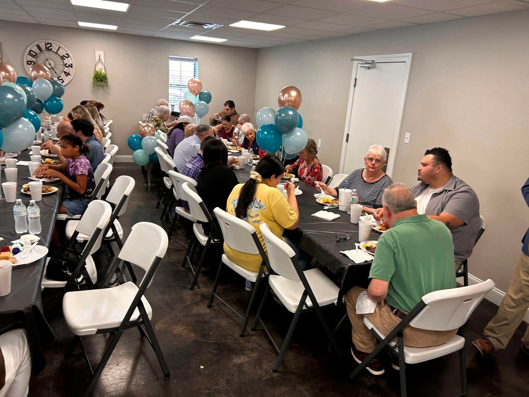 Members talking together at a church fellowship meal